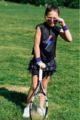 Girl wearing matching tennis set from Love Set Match tennis wear