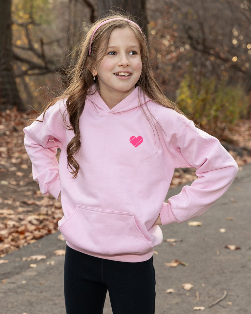 Girl in pink tennis hoodie from Love Set Match tennis wear